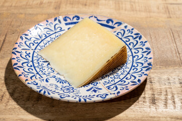 Cheese collection, piece of spanisch hard manchego cheese made in La Mancha region from sheep milk
