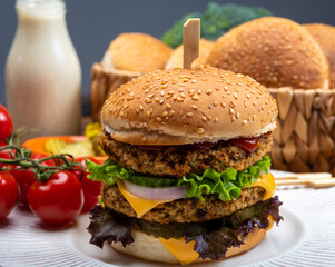 Tasty vegetarian cheeseburgers with round patties or burgers made from grains, vegetables and legumes