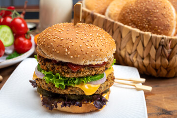 Tasty vegetarian cheeseburgers with round patties or burgers made from grains, vegetables and legumes