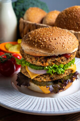 Tasty vegetarian cheeseburgers with round patties or burgers made from grains, vegetables and legumes