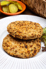 Making vegetarian hamburgers with round patties or burgers made from grains, vegetables and legumes