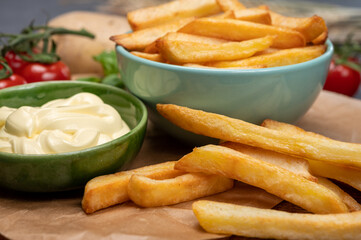Bown with fresh cooked french fries potato chips with belgian mayonnaise sauce