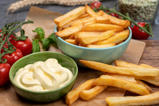 Bown with fresh cooked french fries potato chips with belgian mayonnaise sauce
