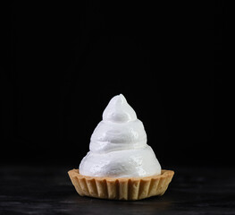 Homemade lemon meringue pie baked on black background