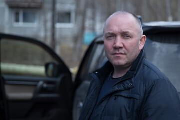 Portrait of a man with a receding hairline. The problem of baldness.