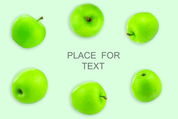 Creative layout with green apples on a light background. Food concept. Copy spaсe