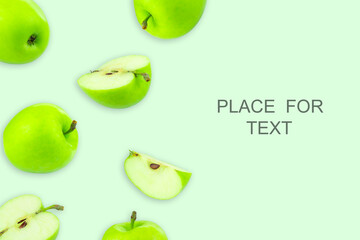 Creative layout with green apples on a light background. Food concept. Copy spaсe