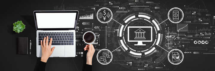 Fintech theme with person using laptop computer