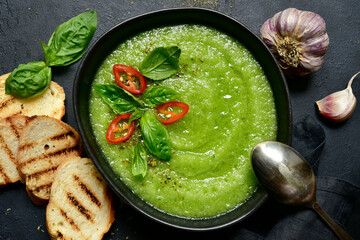Cucumber gazpacho - traditional spanish cold soup. Top view with copy space.