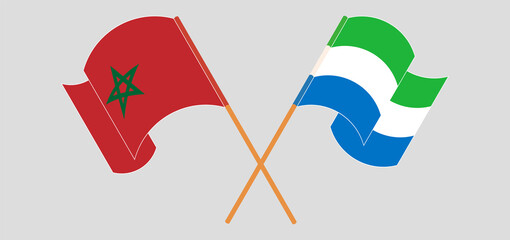 Crossed and waving flags of Morocco and Sierra Leone