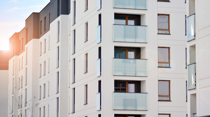 Architectural details of modern apartment building. Modern european residential apartment building complex with sunlight.