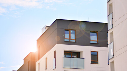 Architectural details of modern apartment building. Modern european residential apartment building complex with sunlight.
