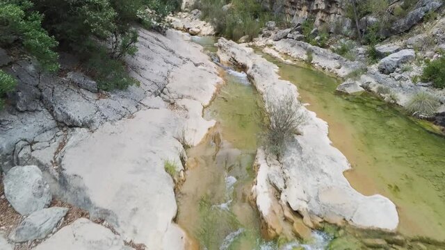 drone view of the Borosa riverbed and natural pools. Located in the Natural Park of the Sierras de Cazorla, Segura y las Villas, Spain.
