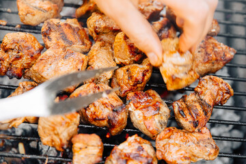 Barbecue at home when the weather is nice. Prepare food outside. Meat on the grill 