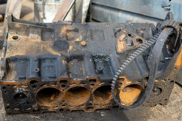 4 cylinder one motor head with disassembled exhaust manifold of old industrial heavy truck V 8 diesel engine with separate covers closeup, vehicle utilization.