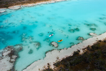 Kayak in Bacalar lagoon Los Rapidos. Aerial view. - obrazy, fototapety, plakaty