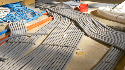 CLOSE UP: Electricity tubing is laid across the first floor of a housing project