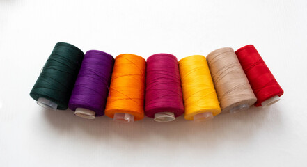 Panorama of colorful bobbins isolated on a white background