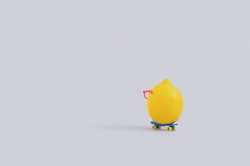 Minimal summer fruit concept with lemon riding skateboard