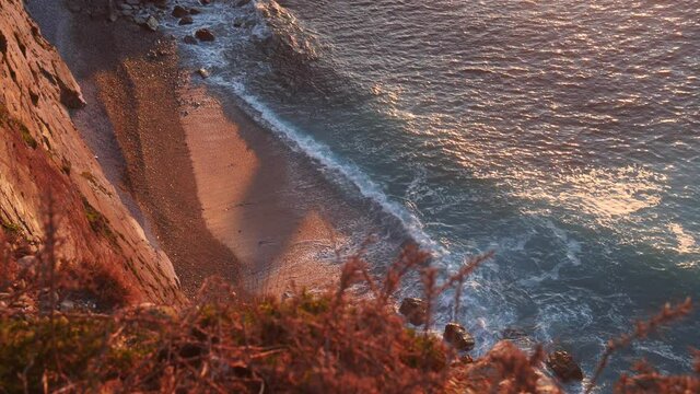 High rocky cliff and sea waves, Cabo Busto, Asturias coast in northern Spain. View from above.