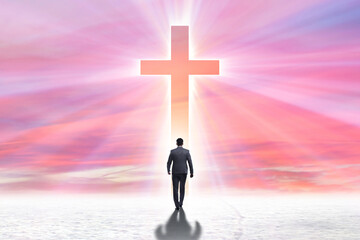Religious concept with cross and lonely man
