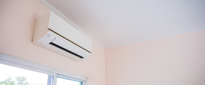 Air conditioner split type wall mounted in home room concepts of cool or heat temperature and service repairing and maintenance.