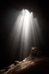 Light from the top of Jomblang Cave in Java island, Indonesia