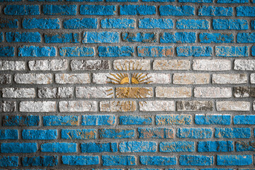National flag of Argentina. depicting in paint colors on an old brick wall. Flag  banner on brick...