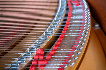 Obraz premium Close up image of interior of grand piano showing strings and structure