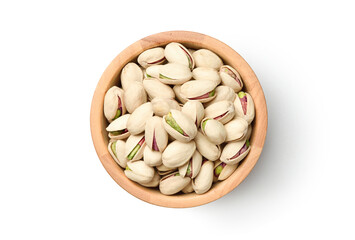 Flat lay of pistachio nuts in wooden bowl isolated on a white background. Clipping path.