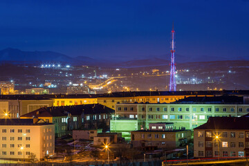 Naklejka premium Night city landscape. Buildings and TV tower view. Magadan, Magadan Region, Siberia, Russia.