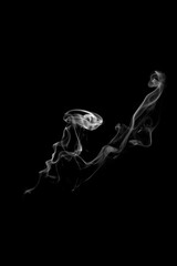 Obraz na płótnie Canvas movement of smoke on black background, smoke background, abstract smoke on black background
