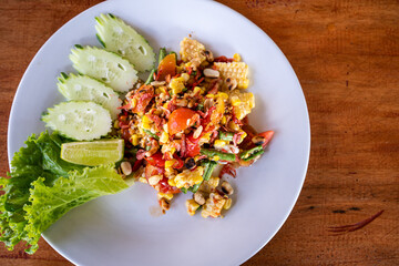 Close-up. Corn papaya salad, Delicious spicy corn papaya salad, Popular Thai food. Fastfood Thai Style food, Thailand street food, Thailand's national dishes,Thai papaya and corn salad.