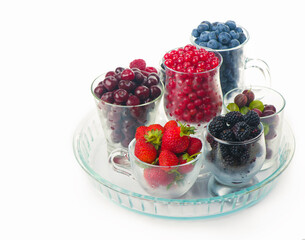 summer fresh berries of different types on a white background