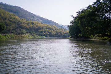 Fototapeta na wymiar Mountain views and the Kok River in Thailand,view of the mountain landscape with Kok river a river flowing its way across Chiang Rai province to Mekong river.
