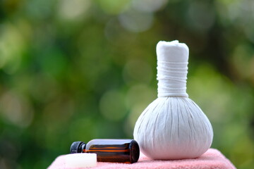 spa concept-spa treatments on wooden table and spa candle light atmosphere in wellness centre