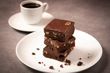 Brownie with almonds and a cup of coffee