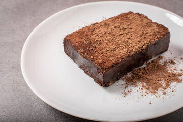 Fototapeta na wymiar brownie with chocolate powder