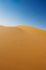 Fototapeta na wymiar Sand pattern and desert slope