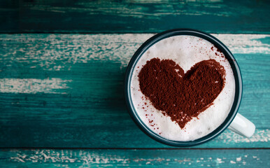 Coffee Lover Concept. Hot Coffee Cup Lay on Table. Latte Art by Cinnamon on Top as Heart Shape. Top View