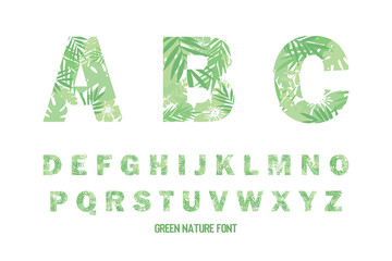 Green nature uppercase font, tropical leaves design capital letters