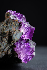 Fluorite (fluorspar) purple pink  crystals inclusion with modern dark background