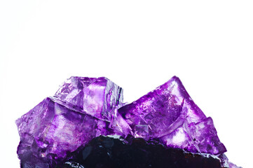 Fluorite (fluorspar) purple pink  crystals inclusion with modern white isolated background