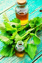 Glass bottle of nettle tincture,healing herbs