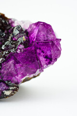 Fluorite (fluorspar) purple pink  crystals inclusion with modern white isolated background