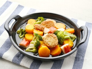 Sapo tahu, chinese food made with tofu, vegetables and seafood. Served on black plate. Selective...