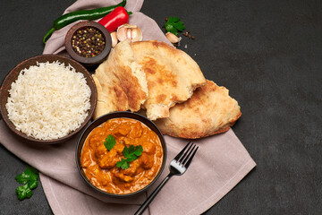 Plate of Traditional Chicken Curry and rice on dark concrete background