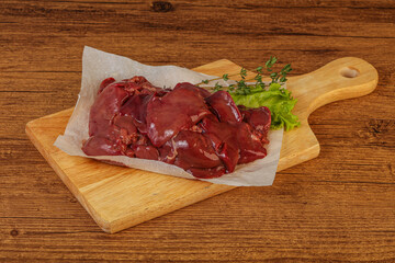 Raw chicken liver over board