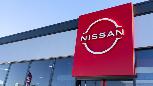 Nissan logo brand and text sign for dealership store of Japanese car shop  Stock Photo