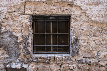 Fototapeta na wymiar Old vintage window on an ancient facade. No people